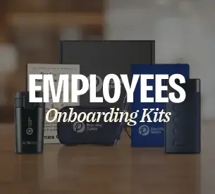 A neatly packed employee onboarding kit with stationery, a backpack and tech accessories