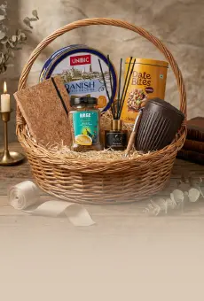 A curated corporate gift hamper with ribbon-wrapped boxes and branded packaging