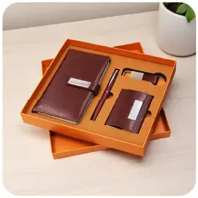 An executive gift set with a diary, pen, cardholder and keychain in a box